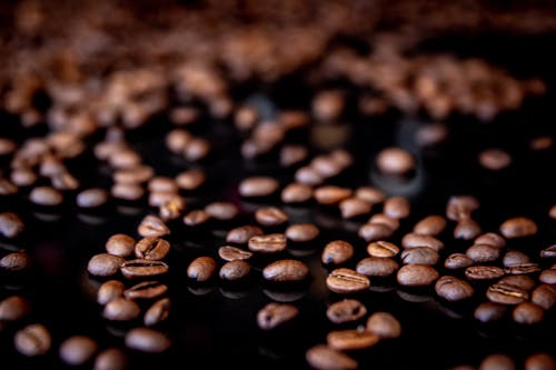 Brown Coffee Beans on a Black Surface