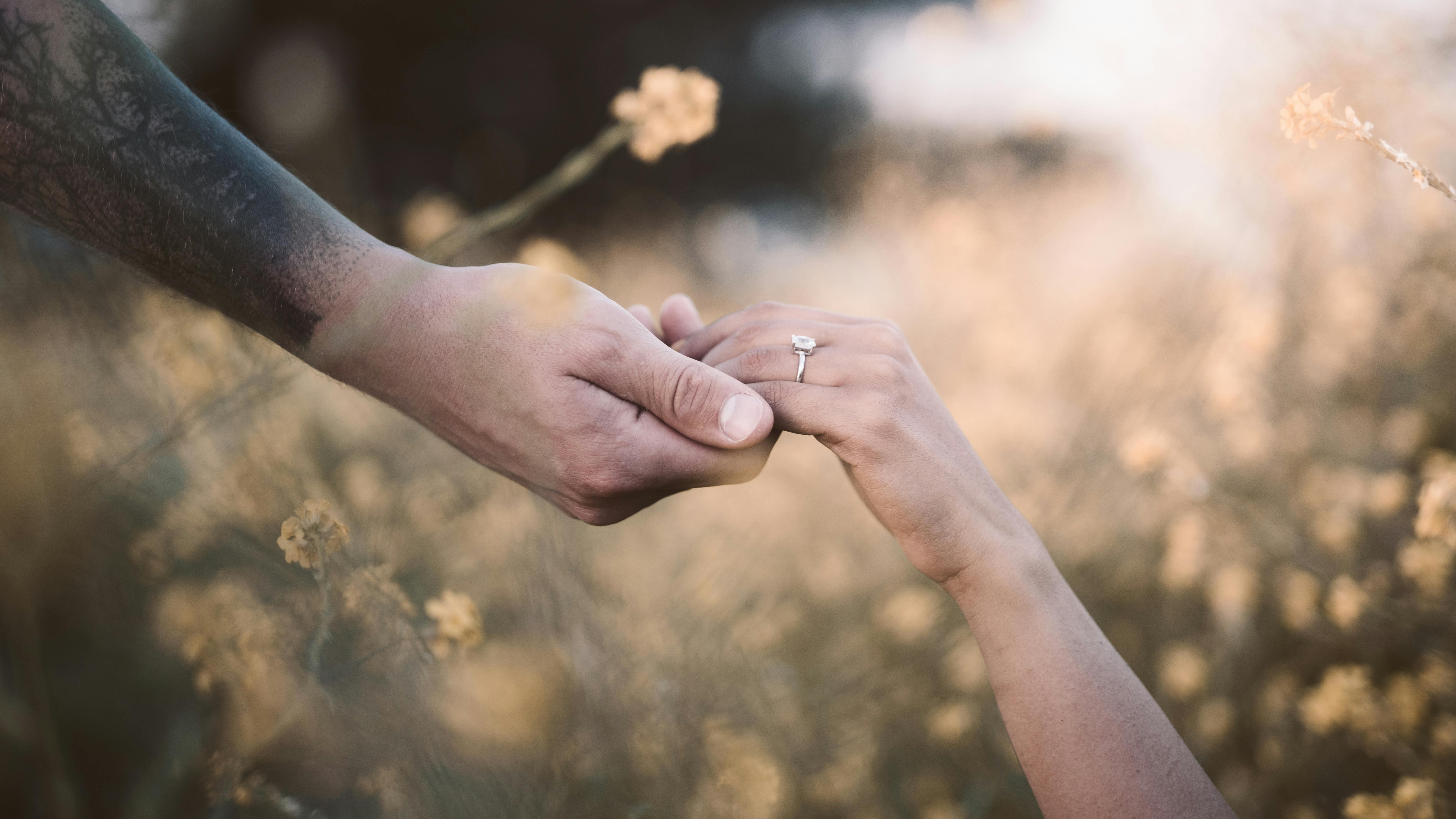 Couple's Hands and an Engagement Ring · Free Stock Photo