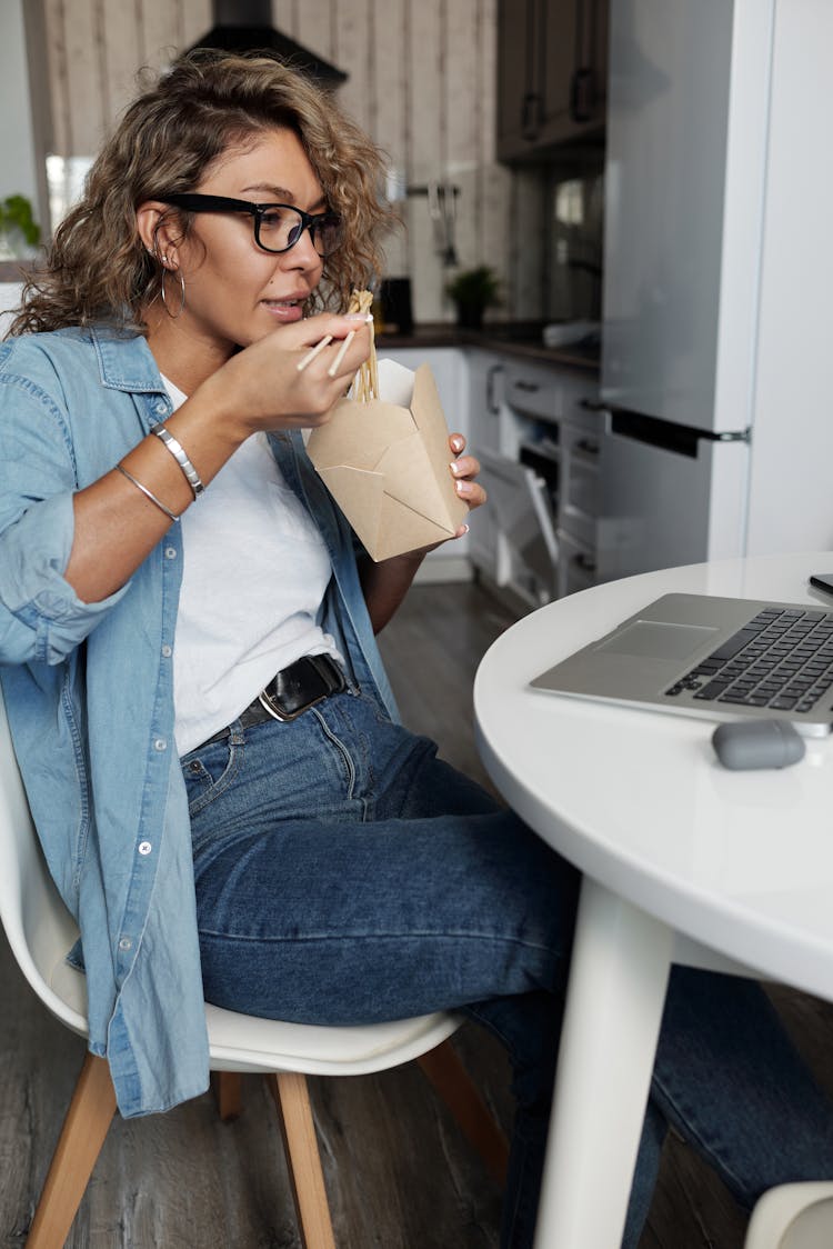 Woman Eating Noodles With Chopsticks