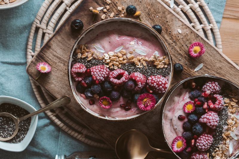 Smoothie bowls topped with berries, chia and granola — photo by Taryn Elliott on Pexels