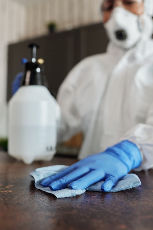 Free Person Wearing Blue Latex Gloves And Face Mask Stock Photo