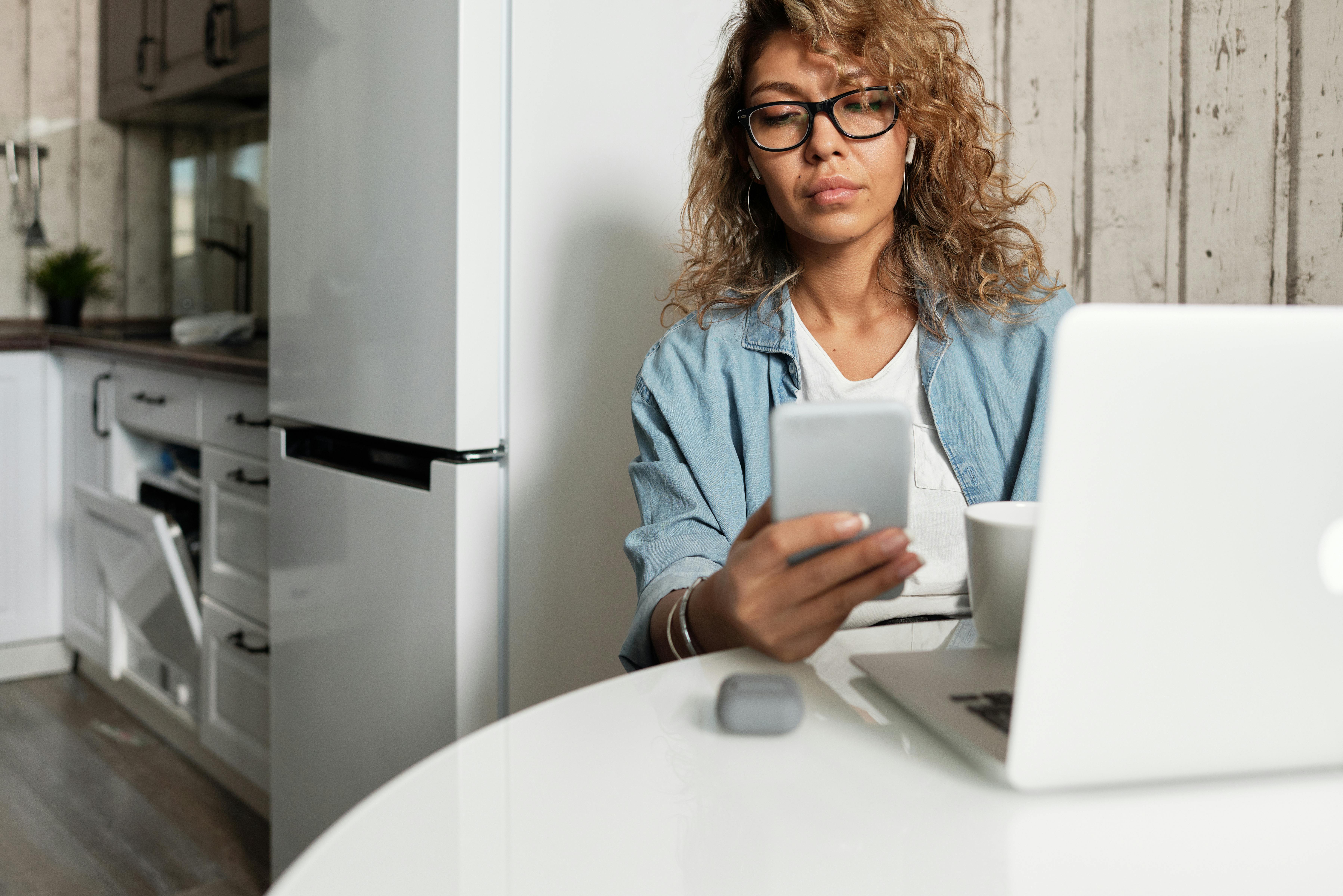 photo of woman using her mobile phone