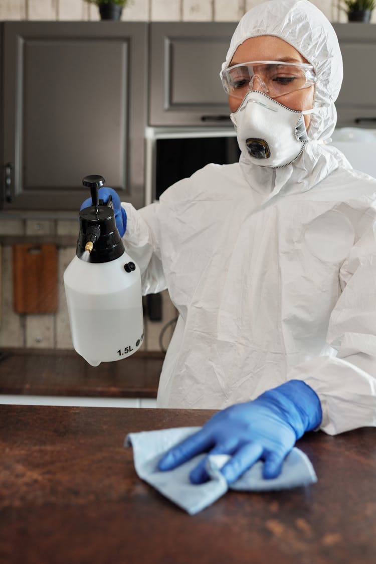 Photo Of Person Cleaning The Table