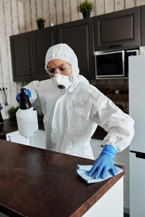 Photo Of Person Cleaning The Table