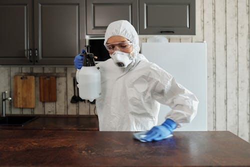 Free Photo Of Person Disinfecting The Table Stock Photo