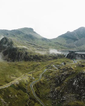 A breathtaking aerial view of the rugged Snowdonia landscape in Gwynedd, Wales.