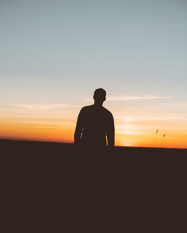 Silhouette Photo Of Person During Sunset