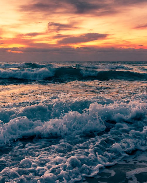 Sea Waves Crashing on Shore during Sunset · Free Stock Photo