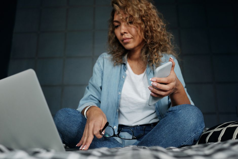 person comparing mobile plans on laptop