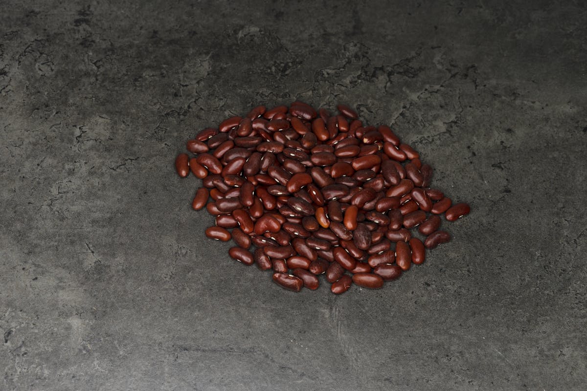 Person holding a game controller while playing on a TV screen