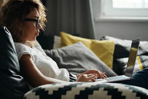 Free Photo Of Woman Using Her Laptop Stock Photo