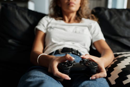 Photo Of Woman Using Game Controller