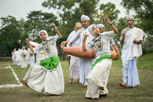 Group of People in White and Green Dress
