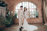 Young Asian just married couple in wedding clothes