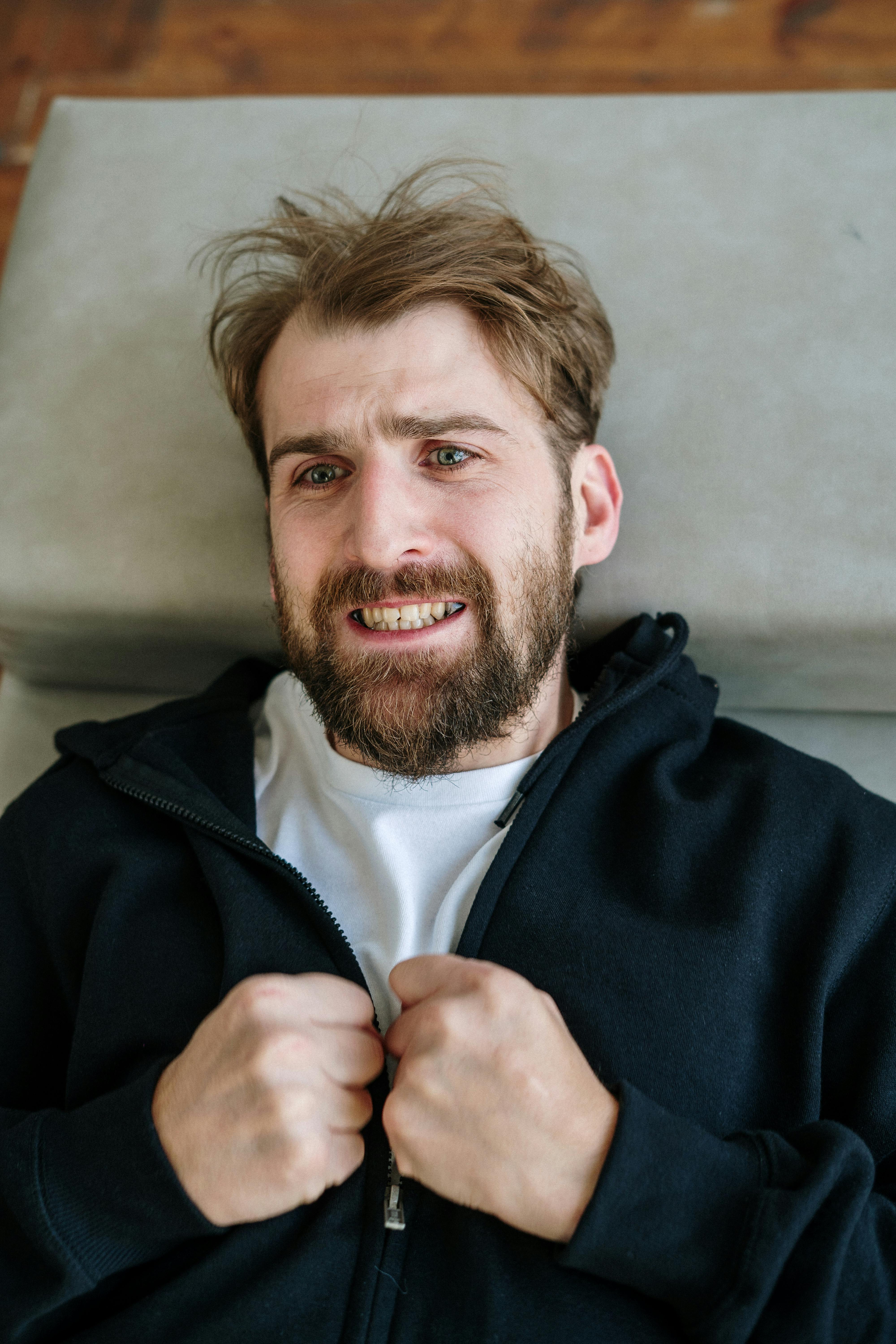 man in blue zip up hoodie