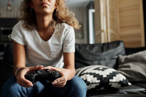 Photo Of Woman Using Game Controller