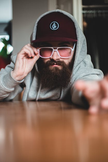 Confident hipster resting in room · Free Stock Photo