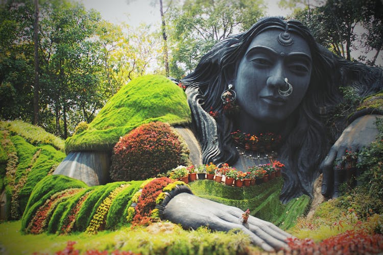 Woman Statue Dressed With Plants And Flowers