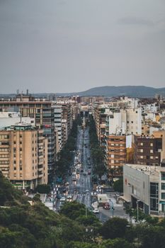 Explore the bustling urban landscape of Alicante with this dynamic aerial cityscape view.