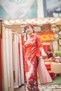 Woman Posing in Red and White  Traditional Dress