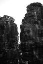 Amazing scenery of massive rough rocky cliffs with carved faces on slopes located in Angkor Thom Cambodia