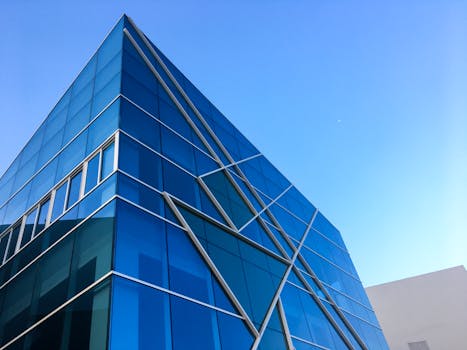 Striking blue glass building against a clear sky in Hải Châu, Vietnam.
