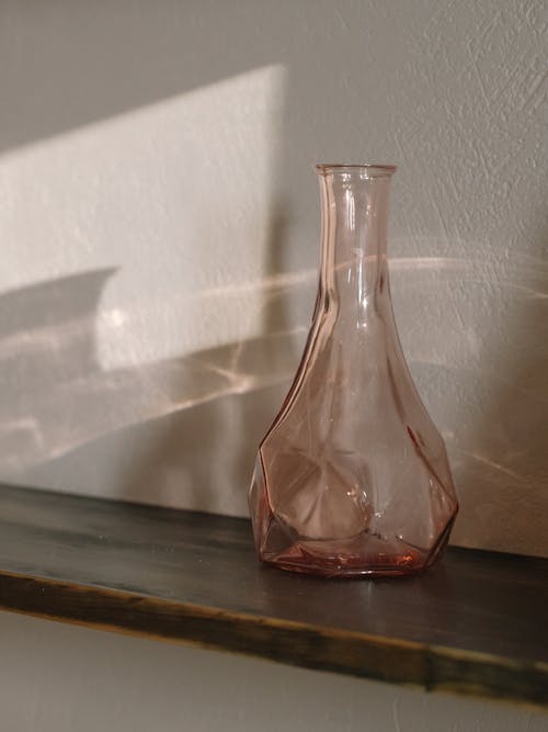 Free Clear Glass Vase on Brown Wooden Table Stock Photo