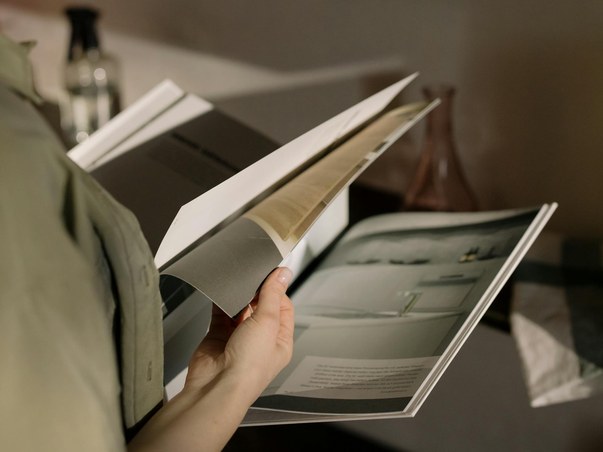 Person turning Pages on a Magazine