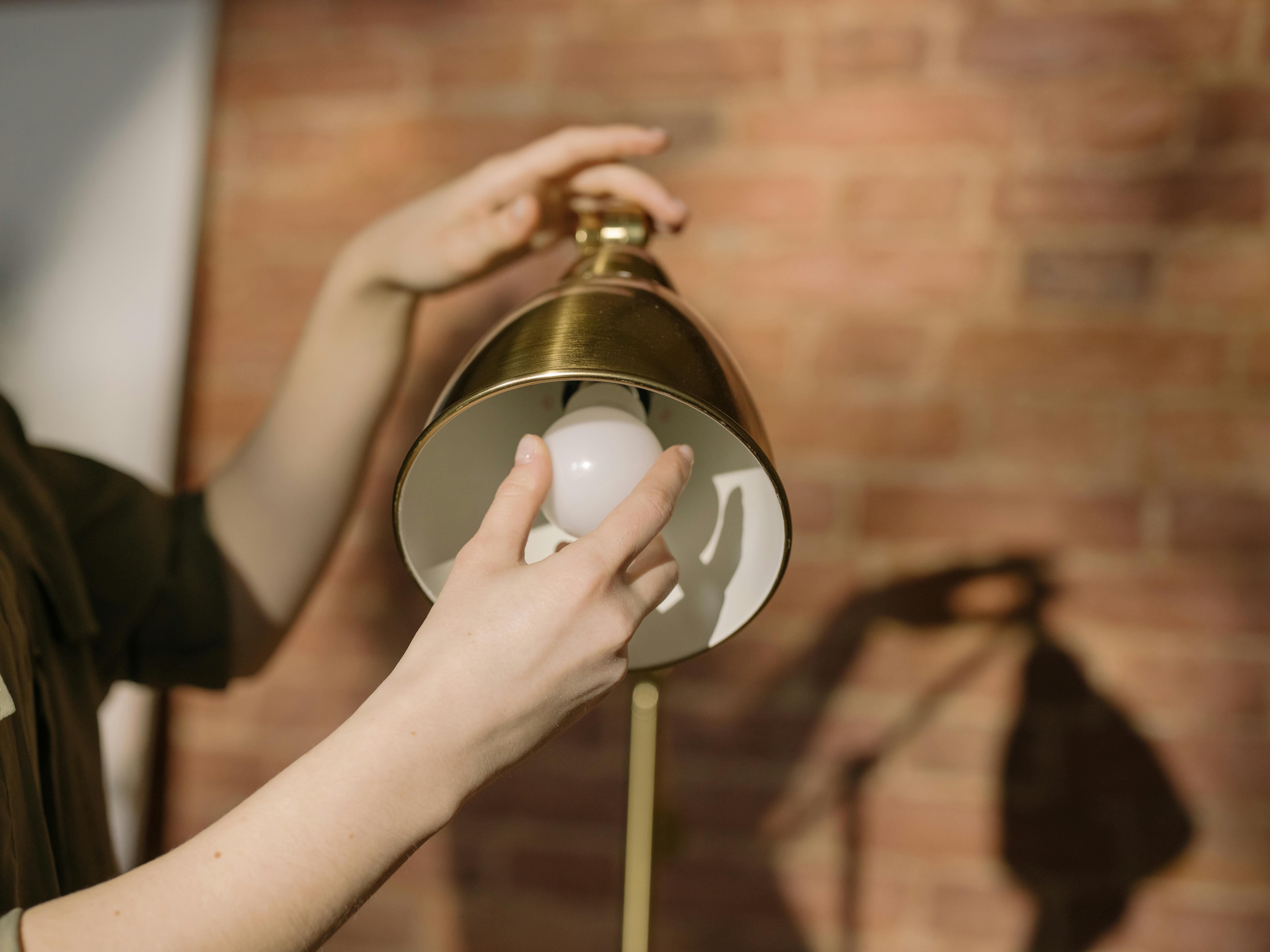 gold and white round pendant lamp