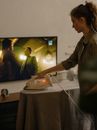 Woman in Gray Button Up Shirt Holding White Ceramic Plate