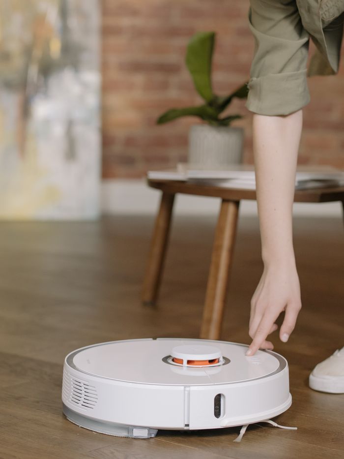 Robot vacuum cleaning a wooden floor