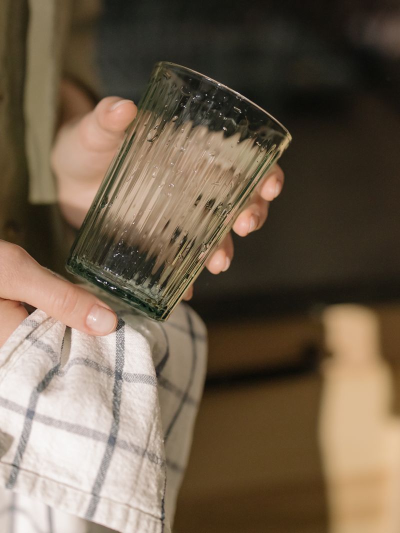 Person organizing and tidying up household items