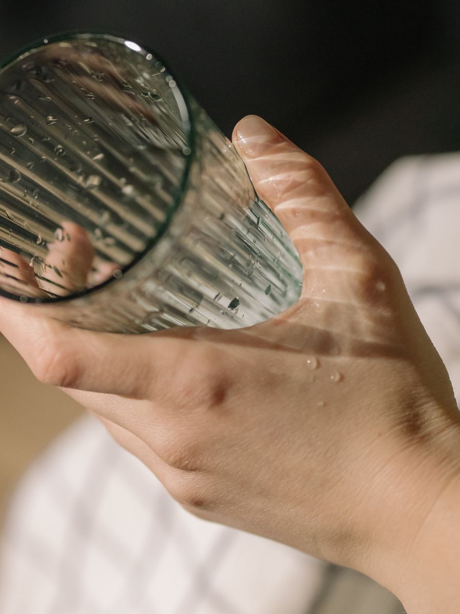 Person cleaning a kitchen counter