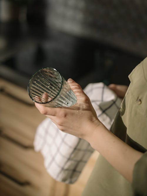 Person Holding Silver Round Coin