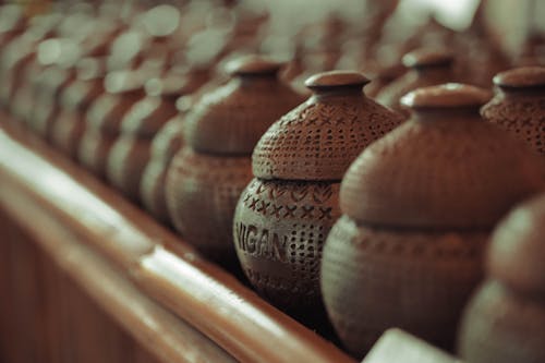 Brown Clay Pots With Cover On Display