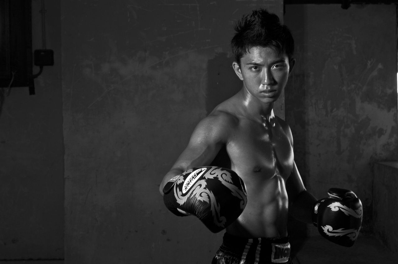 monochrome photo of a determined young boxer in a fighting stance show