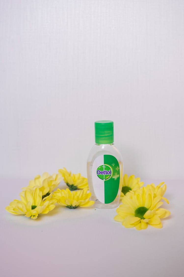 Disinfectant Liquid And Yellow Flowers