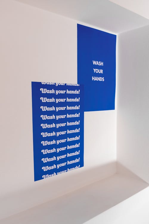Blue and White Poster with Text on White Wall