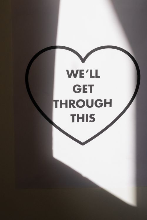 Free Motivational quote inside a heart outline with dramatic lighting effect. Stock Photo