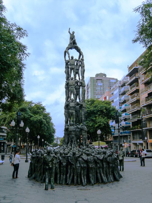 Statue Made of People in City