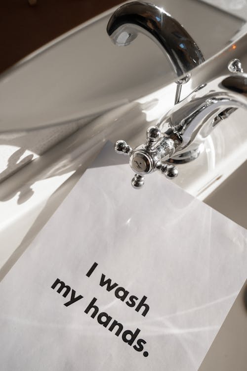 Free White Paper With Message On A Sink Stock Photo