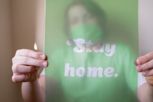 Free Person Holding Green and White Slogan Stock Photo