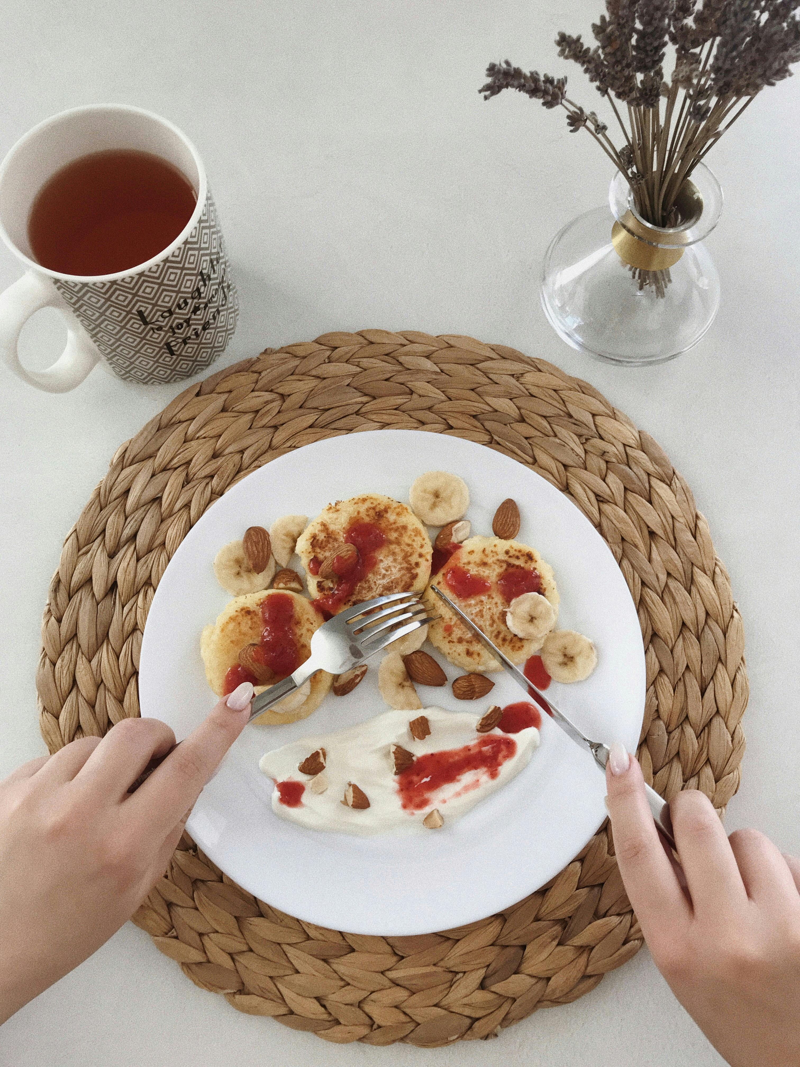 A person eating breakfast. | Photo: Pexels