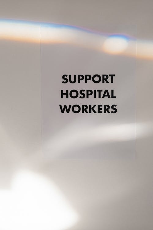 Free Support Hospital Workers Slogan On Blur Background Stock Photo