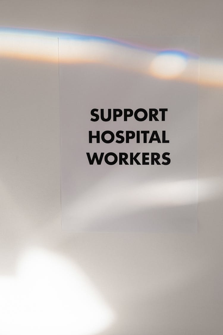 Support Hospital Workers Slogan On Blur Background