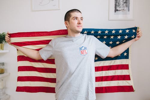 Free Man Holding USA Flag Stock Photo