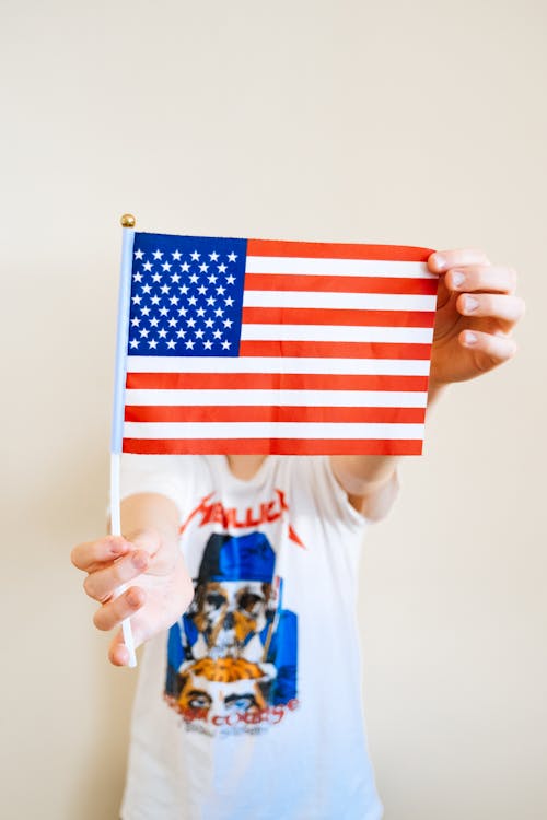 Person Holding a USA Flag 