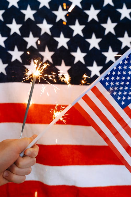 Sparklers and American Flag in Hand