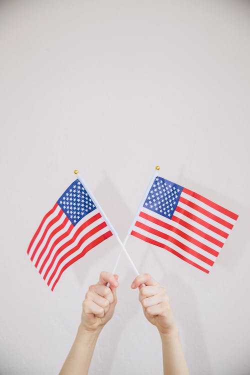 Hands Holding American Flags Aloft 