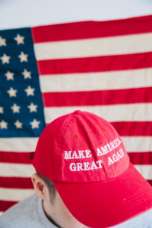 Free Man in Red and Blue Us a Flag Fitted Cap Stock Photo